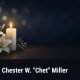 Fostoria News Memorial candle and lilies for Chester W. Chet Miller obituary.